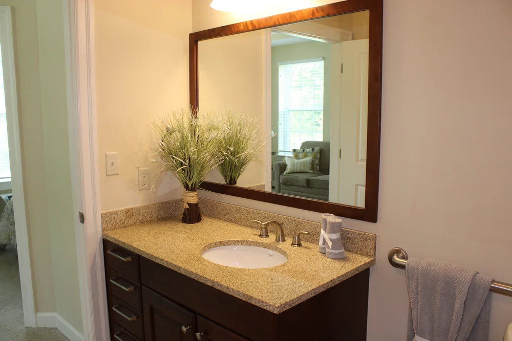 A well-decorated bathroom vanity in a resident's unit