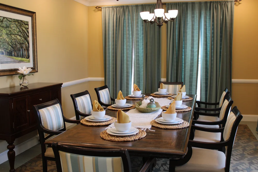 Dining room set up with plates and utensils