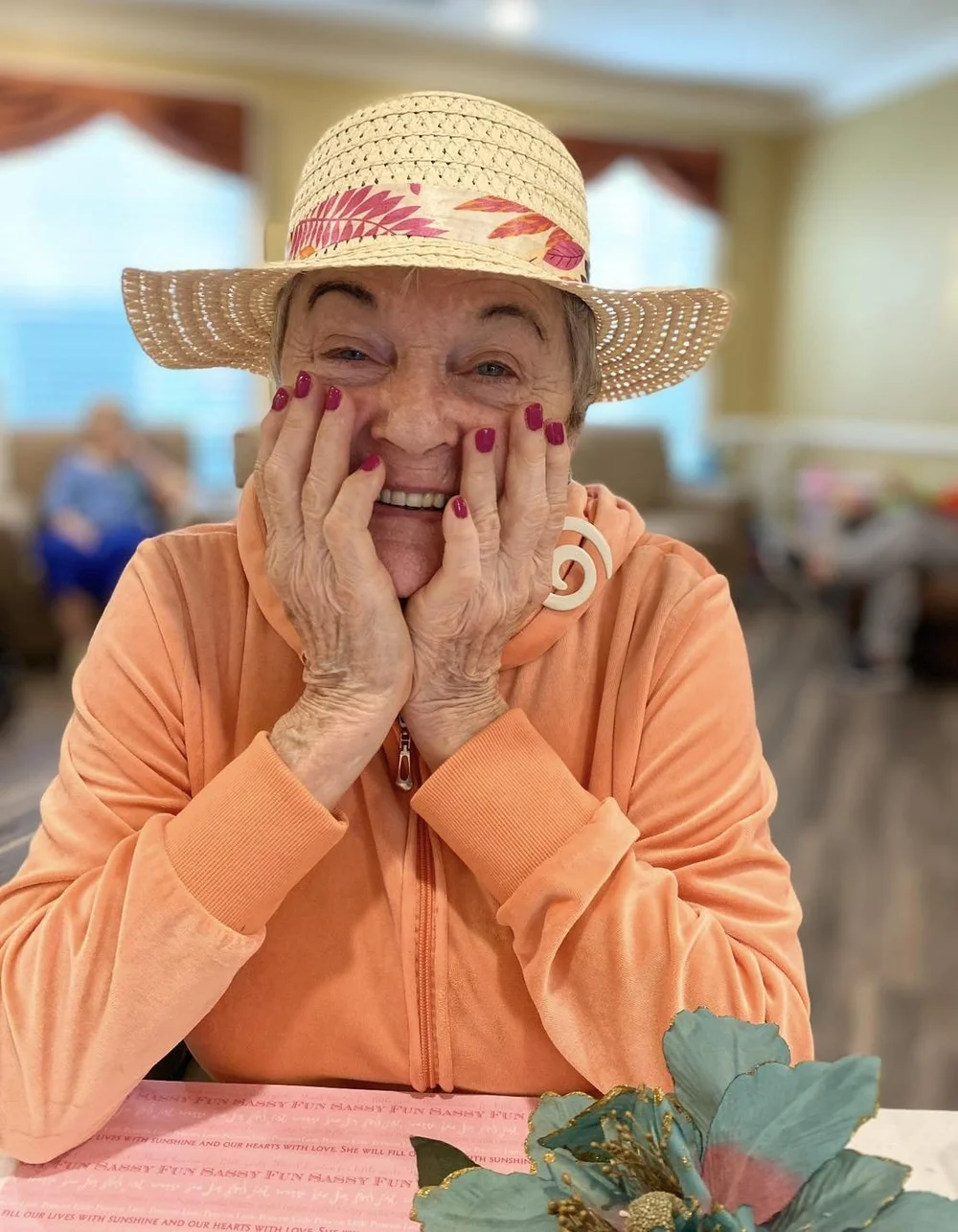 Smiling resident in a cozy common area