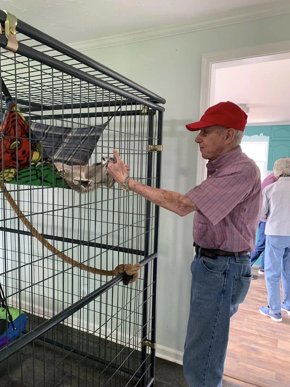 Resident interacting with an animal in a common area