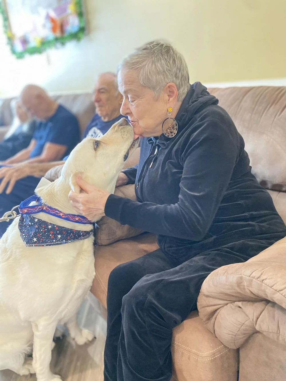 Resident interacting affectionately with a dog