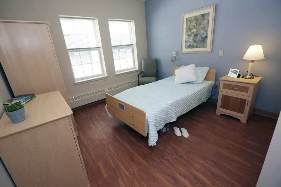 Private resident room with a bed and furnishings
