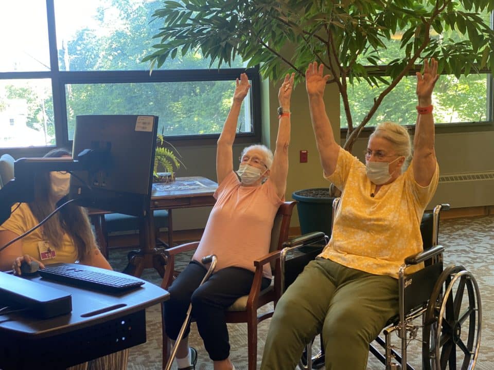 Residents participating in an engaging activity in the facility