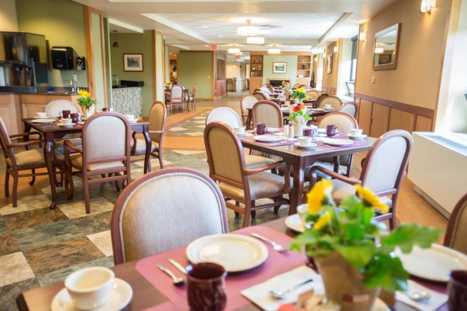 Bright dining area with tables set for meals