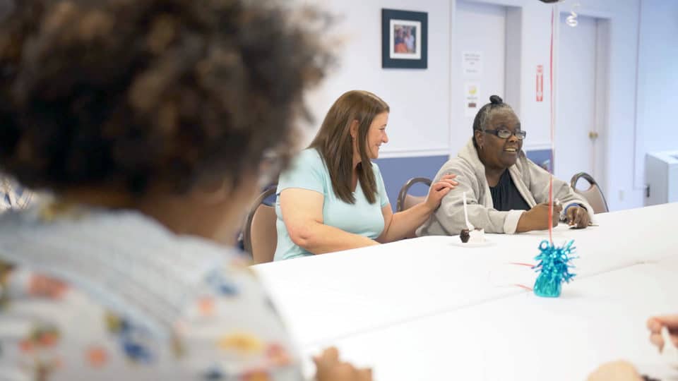 Residents and staff engaged in a group activity