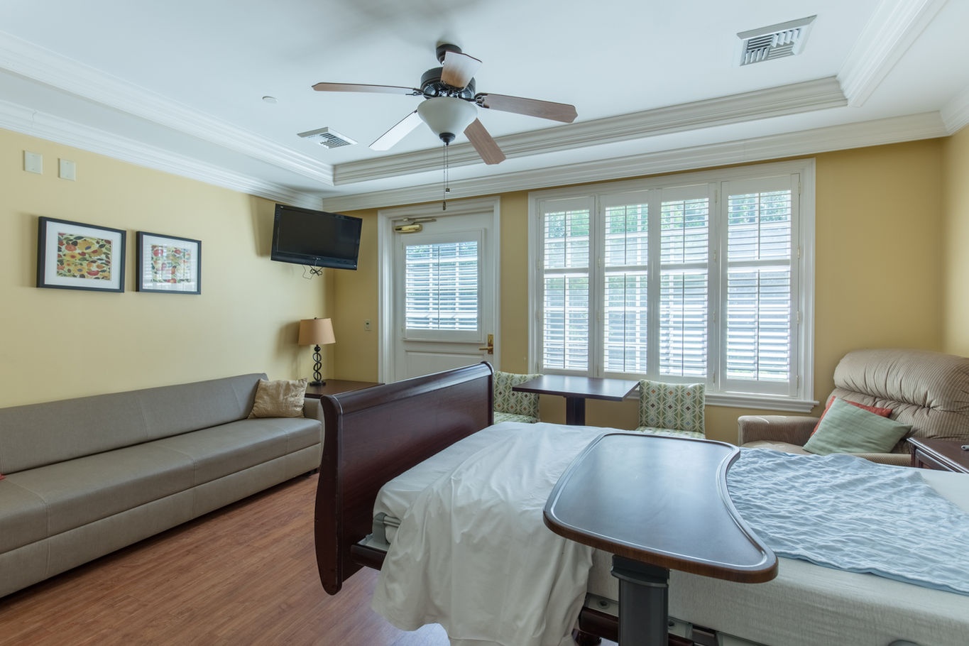 Private resident room with a bed and seating area