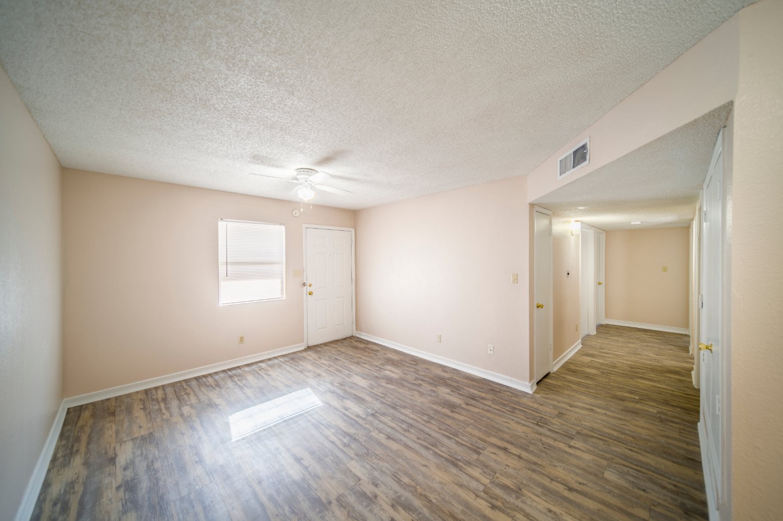 Bright interior view of a resident room with light flooring