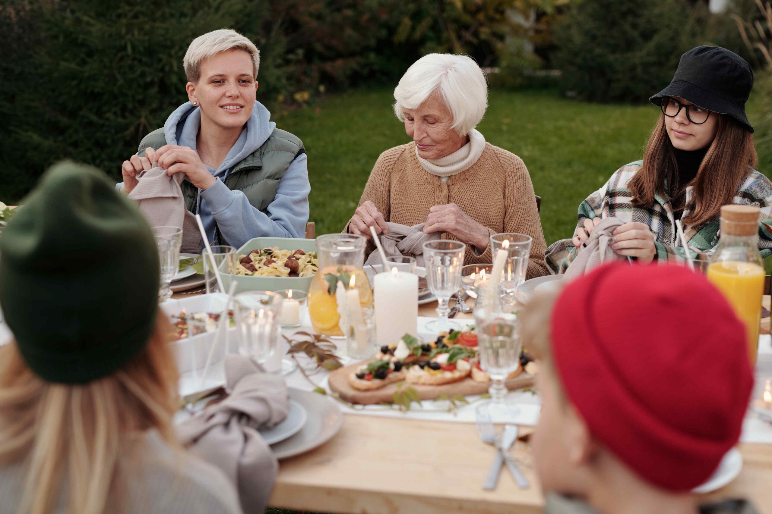 Residents enjoying a meal in an outdoor setting.