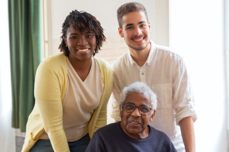 Caregiver and resident smiling together indoors