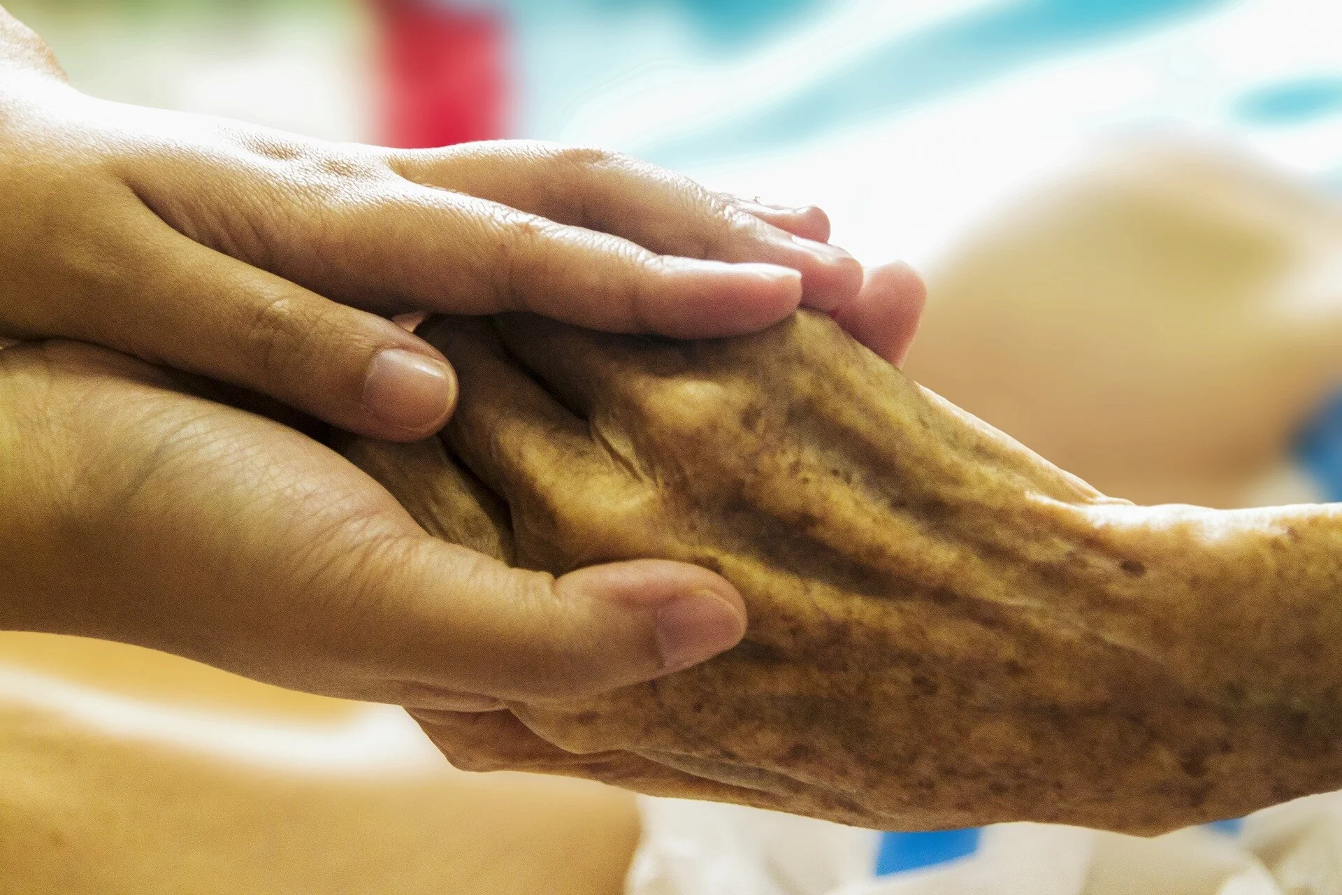 Close-up of two hands holding each other
