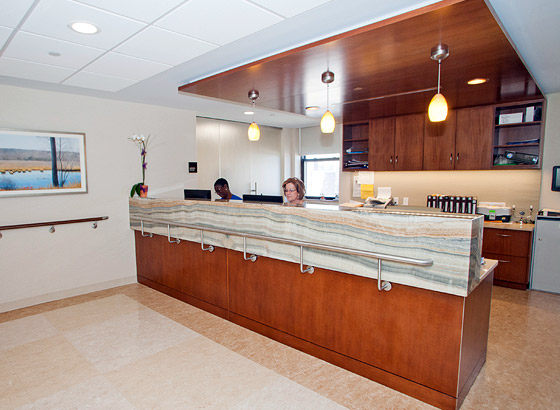 Reception area with staff at the front desk.
