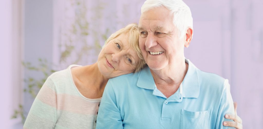 Senior couple sharing a warm moment together.