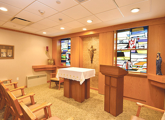 Interior view of a chapel with stained glass windows