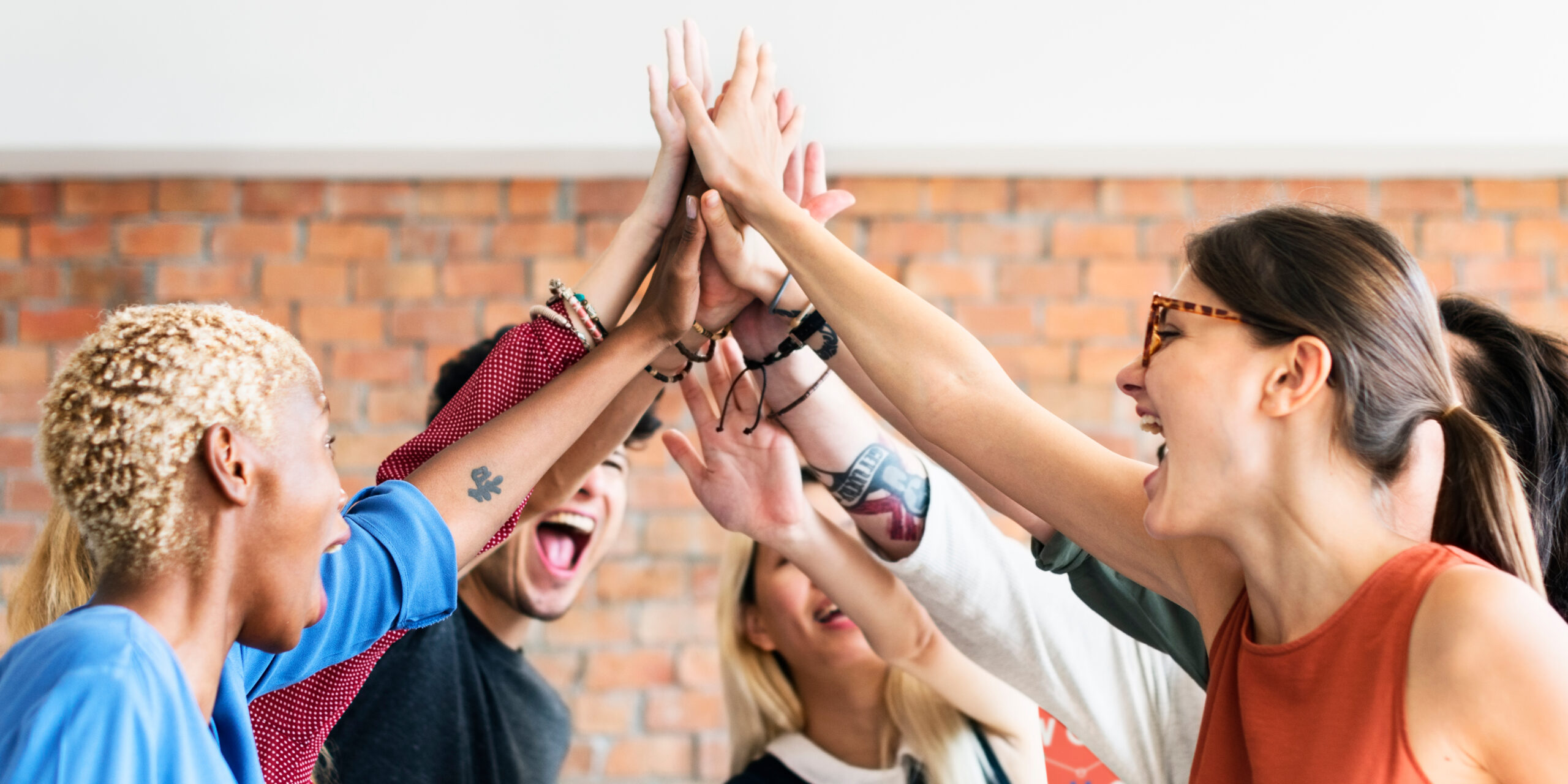 Group of people celebrating together indoors.