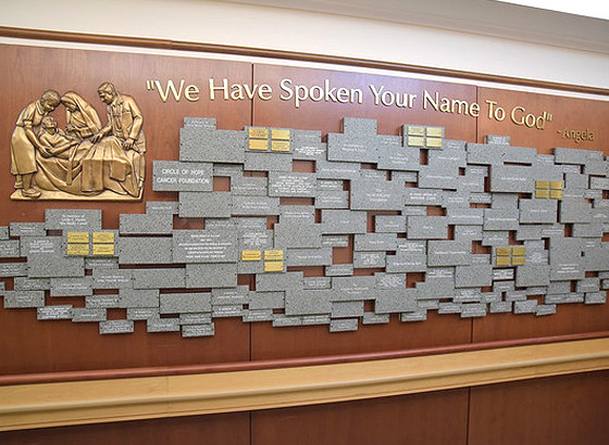 Memorial wall with inscriptions and artwork