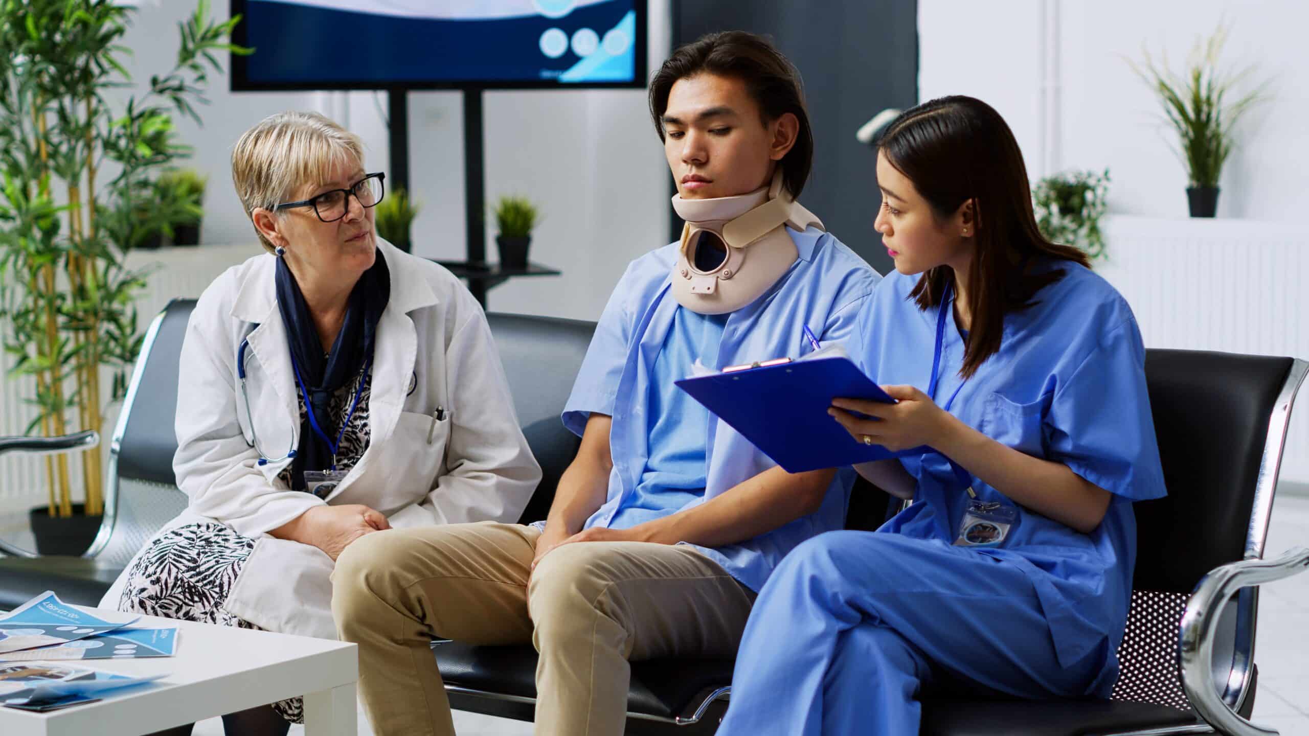 Healthcare professionals discussing with a patient.