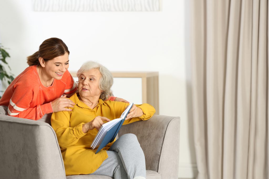 Caregiver and resident engaging in a thoughtful conversation