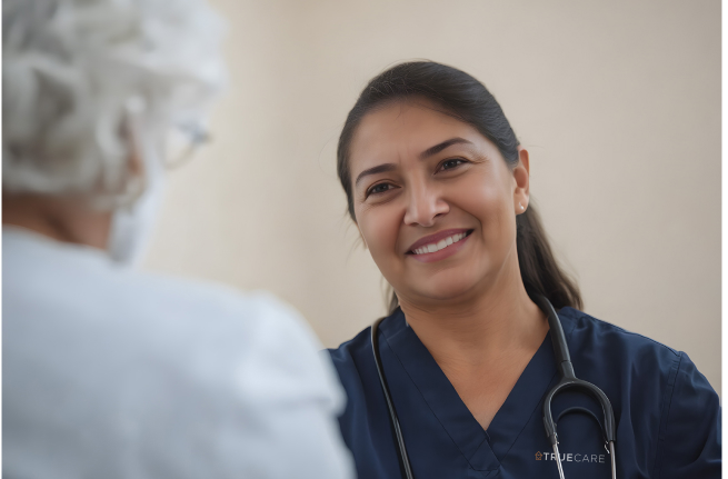 Nurse smiling while interacting with a resident.