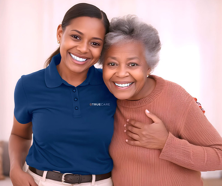 Staff member smiling with a resident