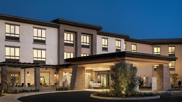 Exterior view of Belmont Village Senior Living building