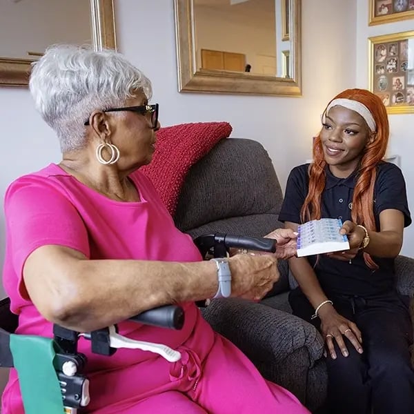 Resident receiving care from staff member