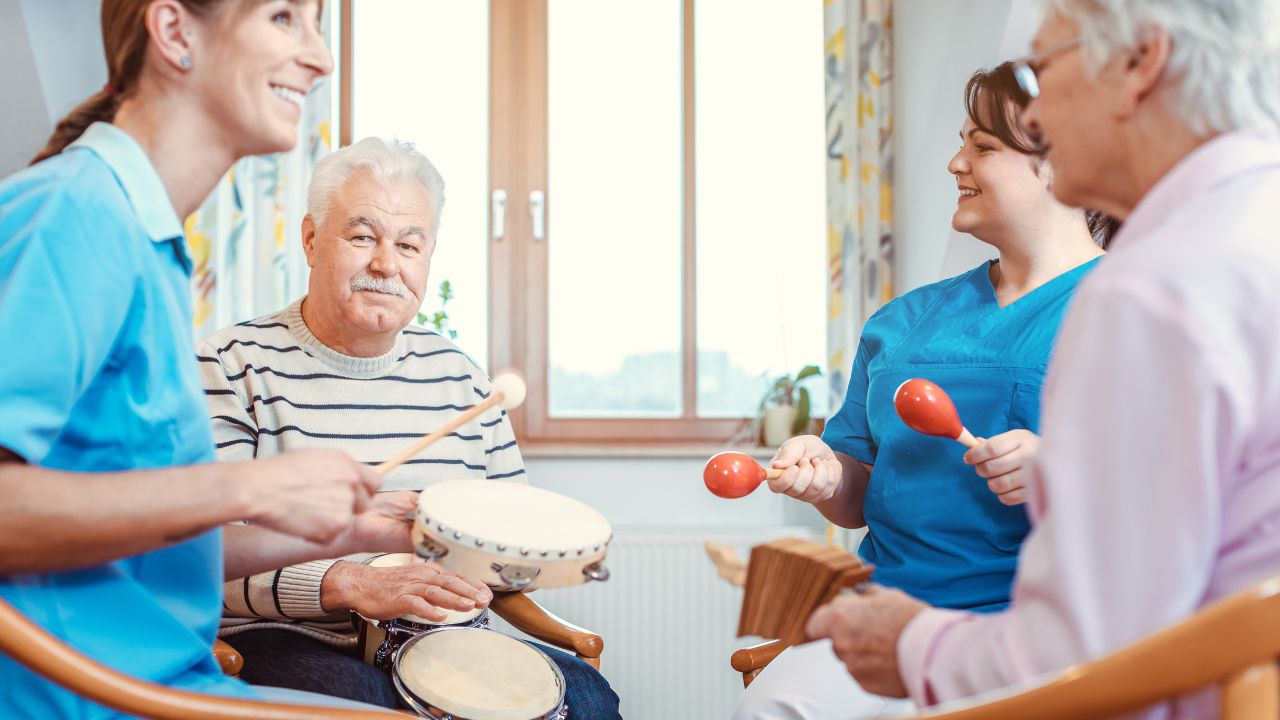 Residents and staff participating in a music activity.