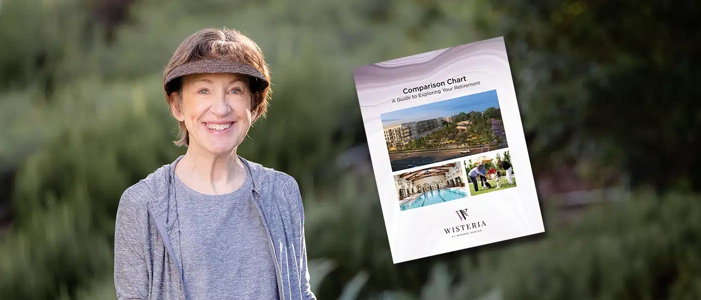 Smiling resident outdoors with a brochure.