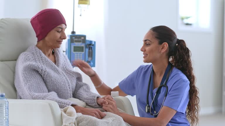 Caregiver comforting a patient in a treatment area.