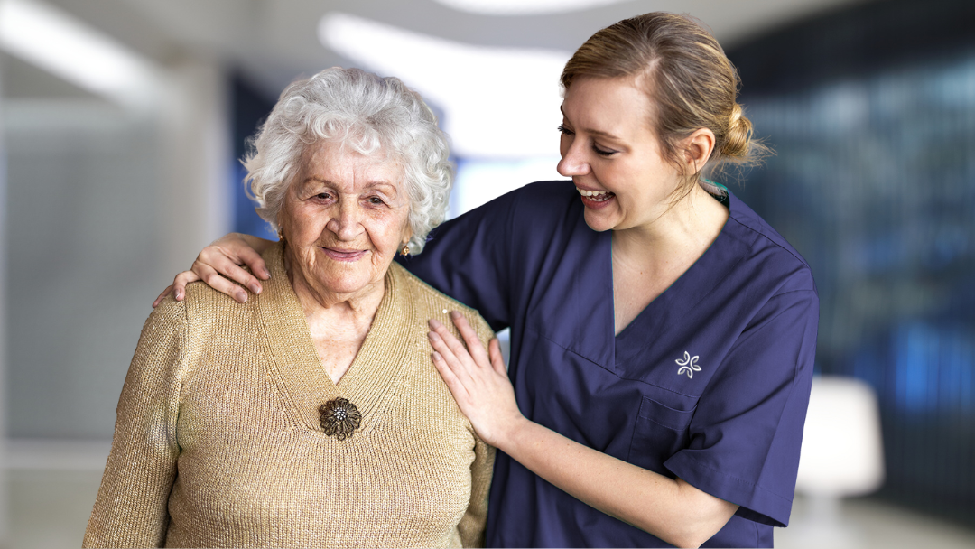 Caregiver and resident enjoying a moment together