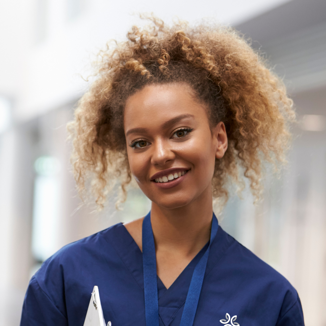 Staff member smiling in a common area