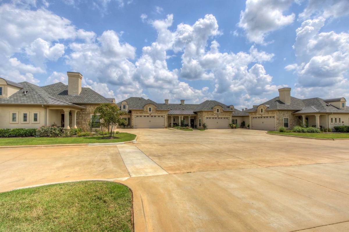 Exterior view of a senior living facility with landscaped grounds