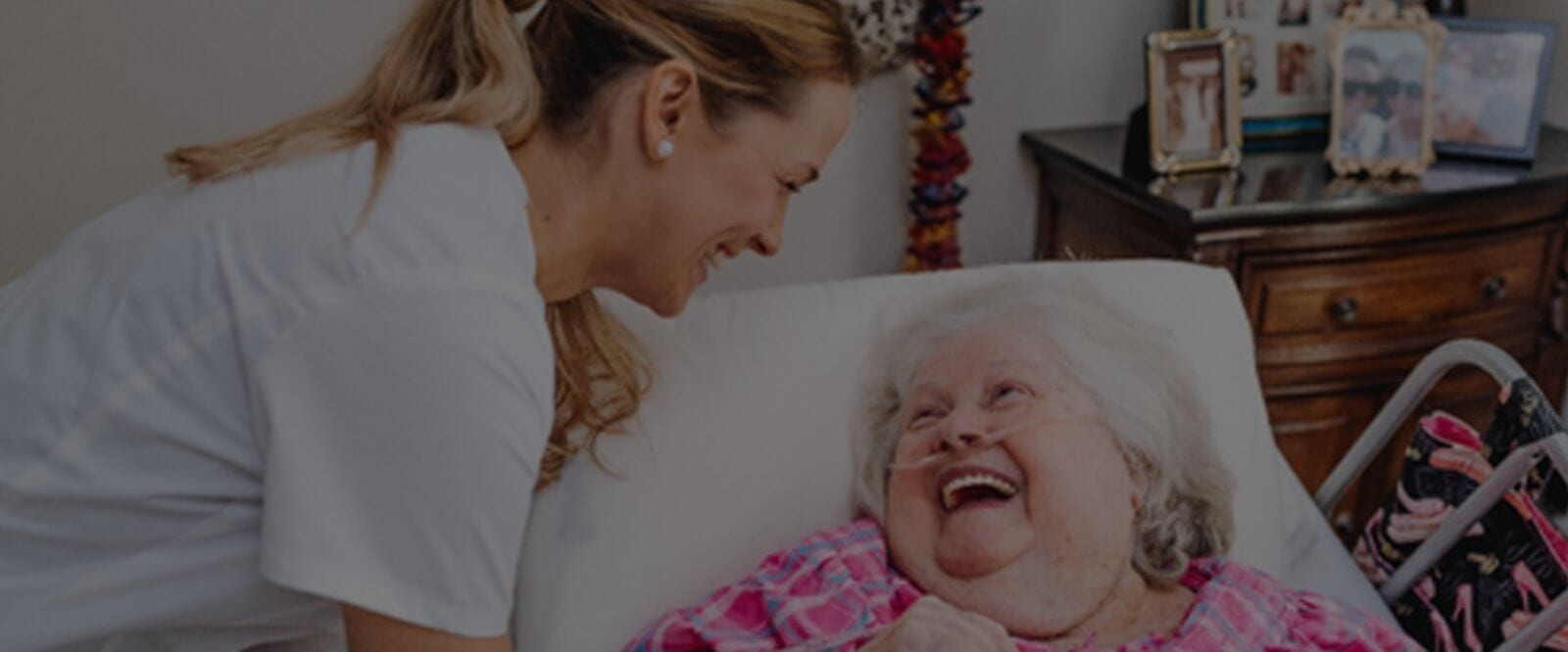 Caregiver interacting with a smiling resident