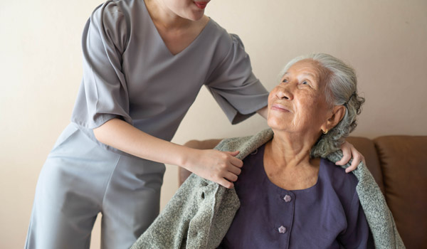 Caregiver interacting with a senior resident