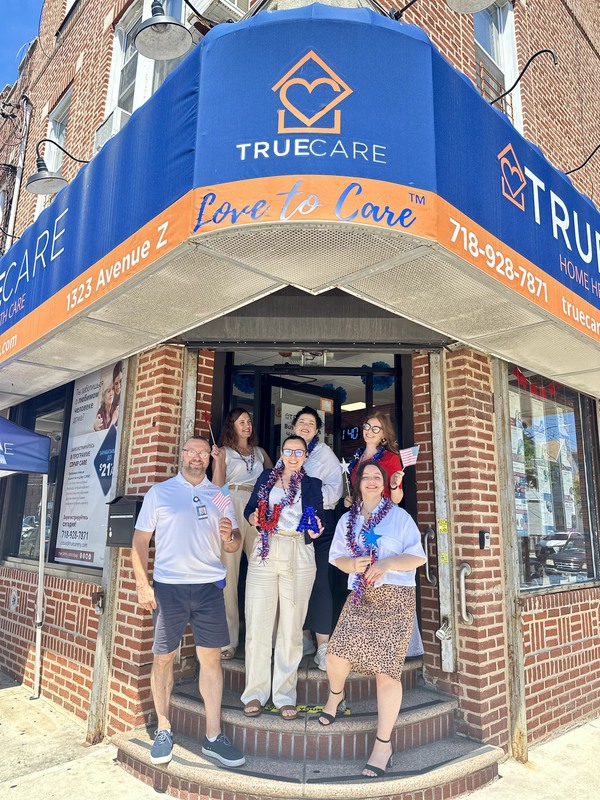 Staff celebrating outside the True Care Home Care facility.