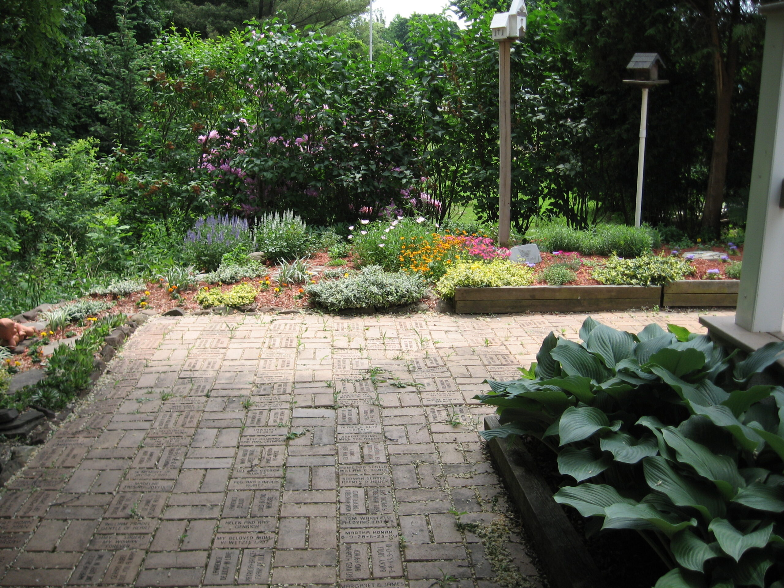 Well-maintained garden area with flowers and plants.