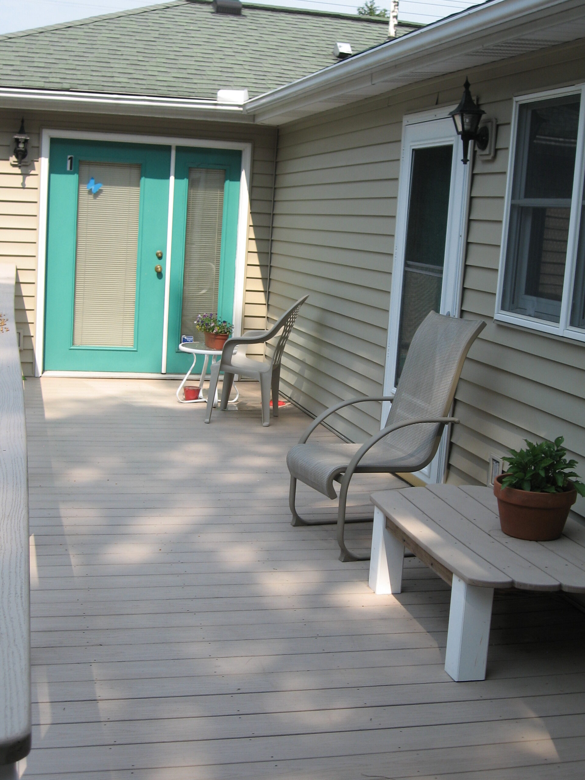 Outdoor patio seating area with plants.