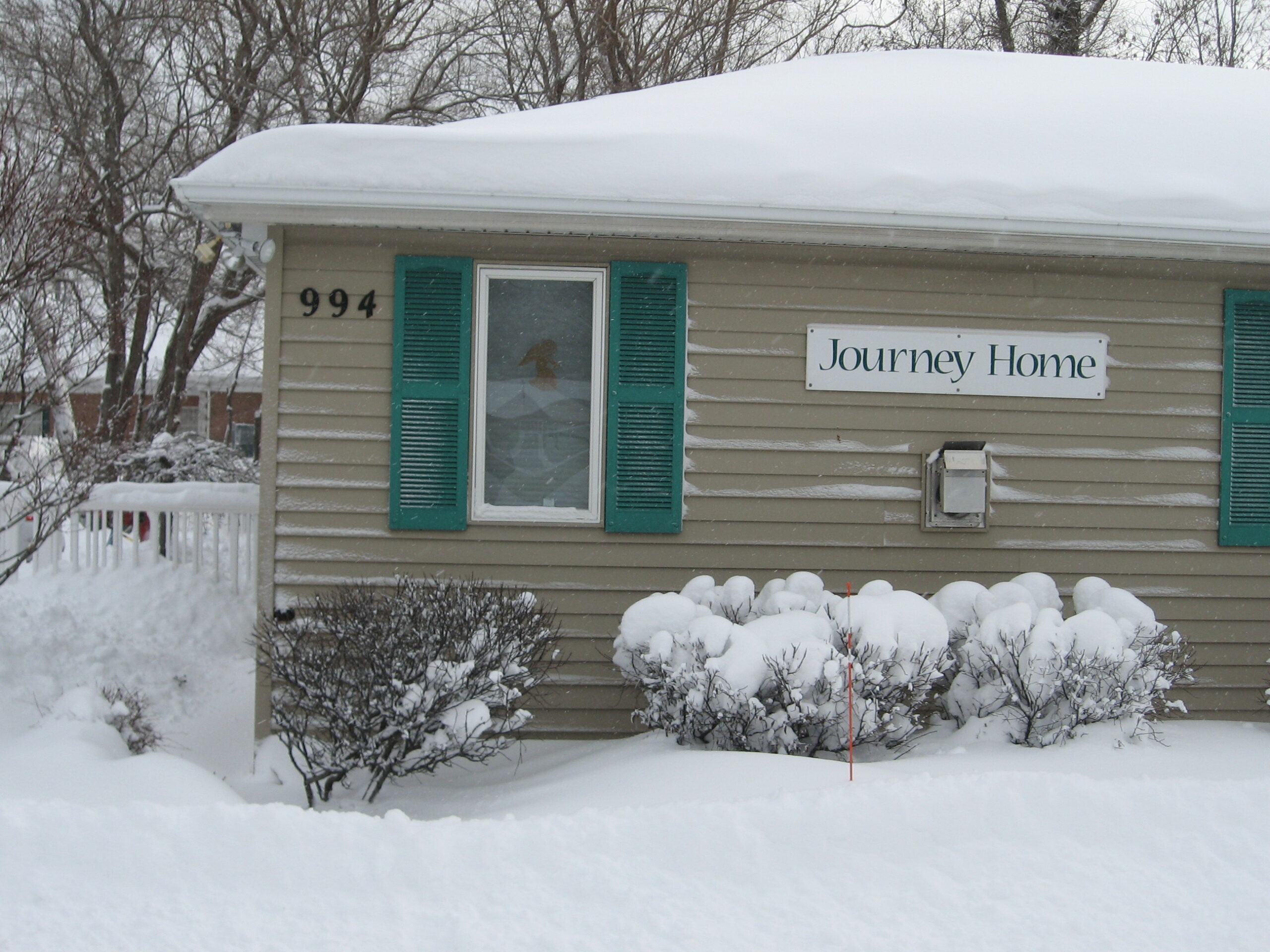 Exterior view of Journey Home with snow
