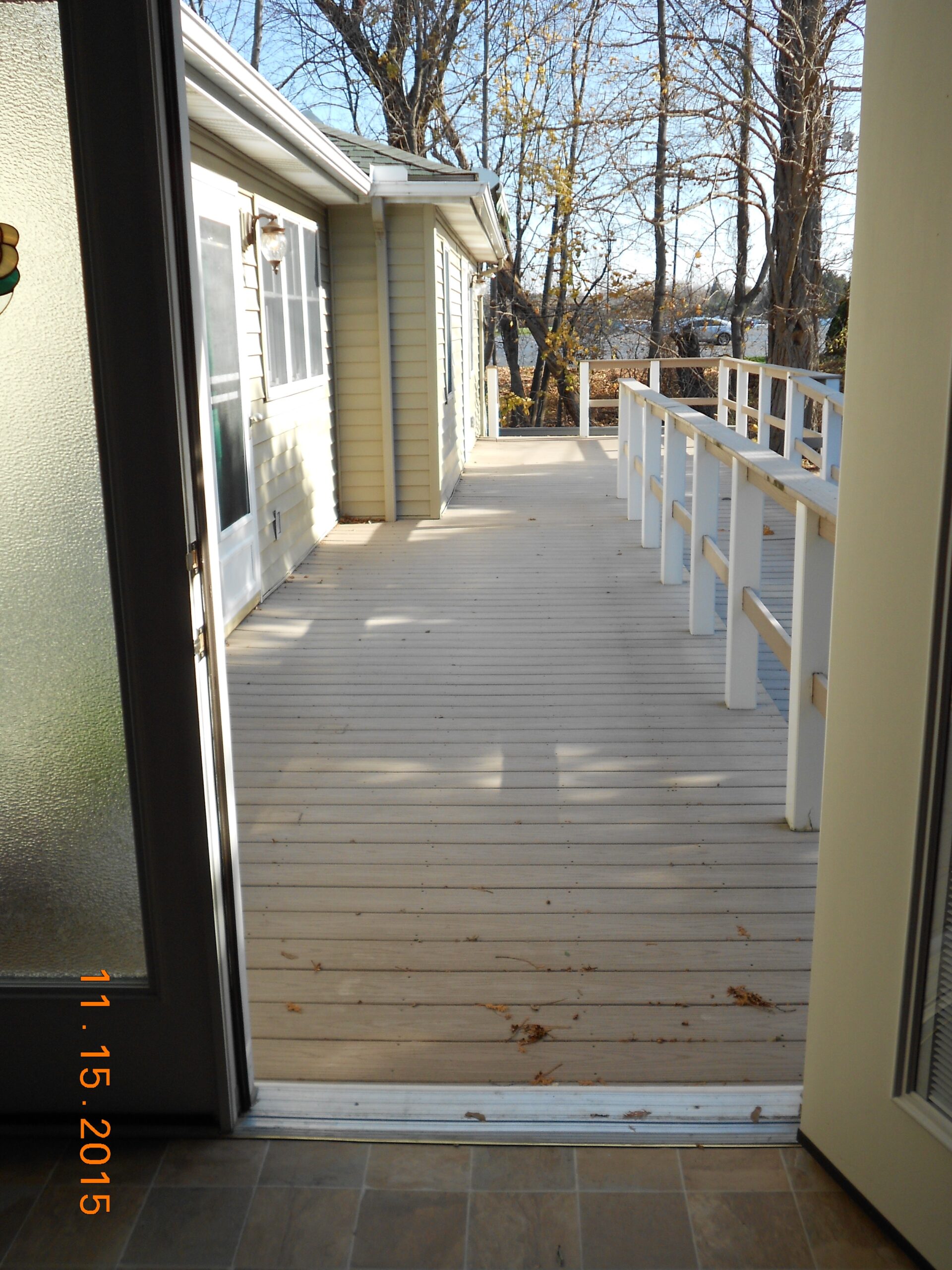 Wooden deck leading to outdoor area.