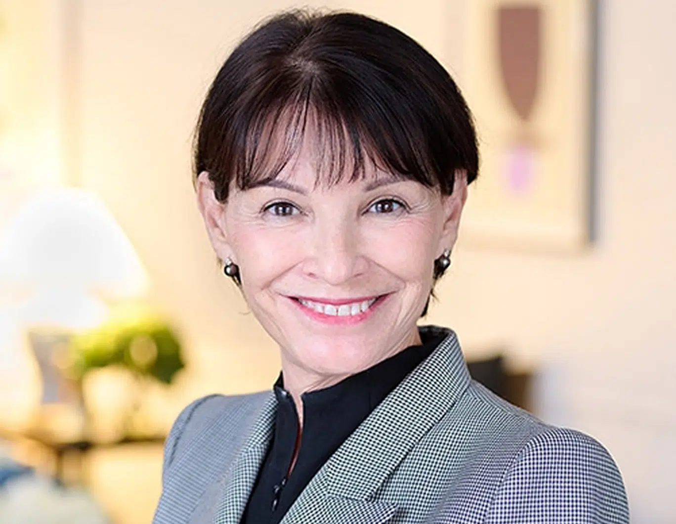 A smiling woman in professional attire