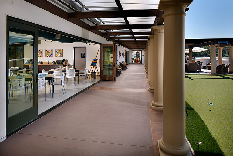 Outdoor area with seating and putting green