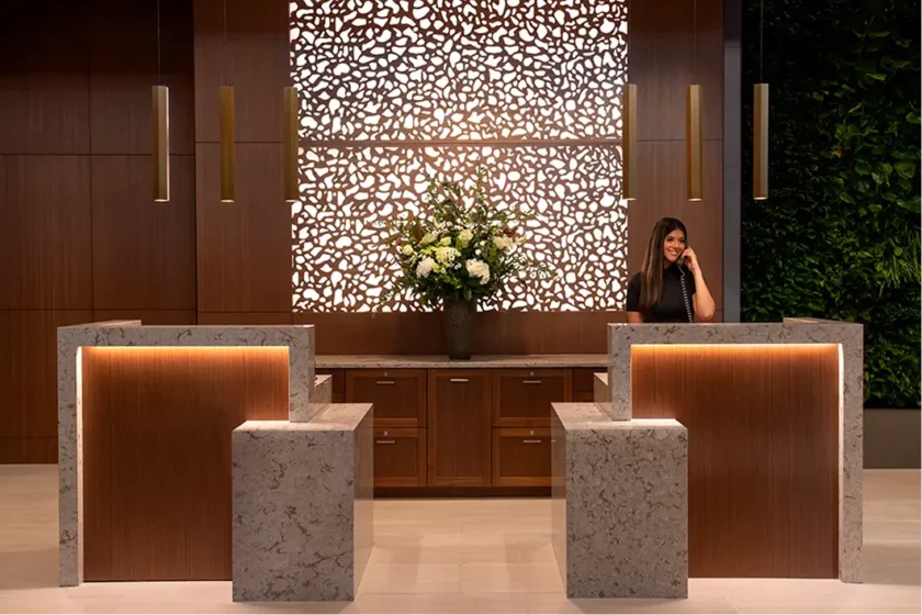 Staff member at a modern reception area
