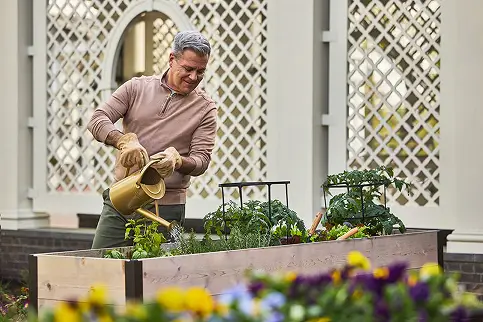 Resident gardening in an outdoor space