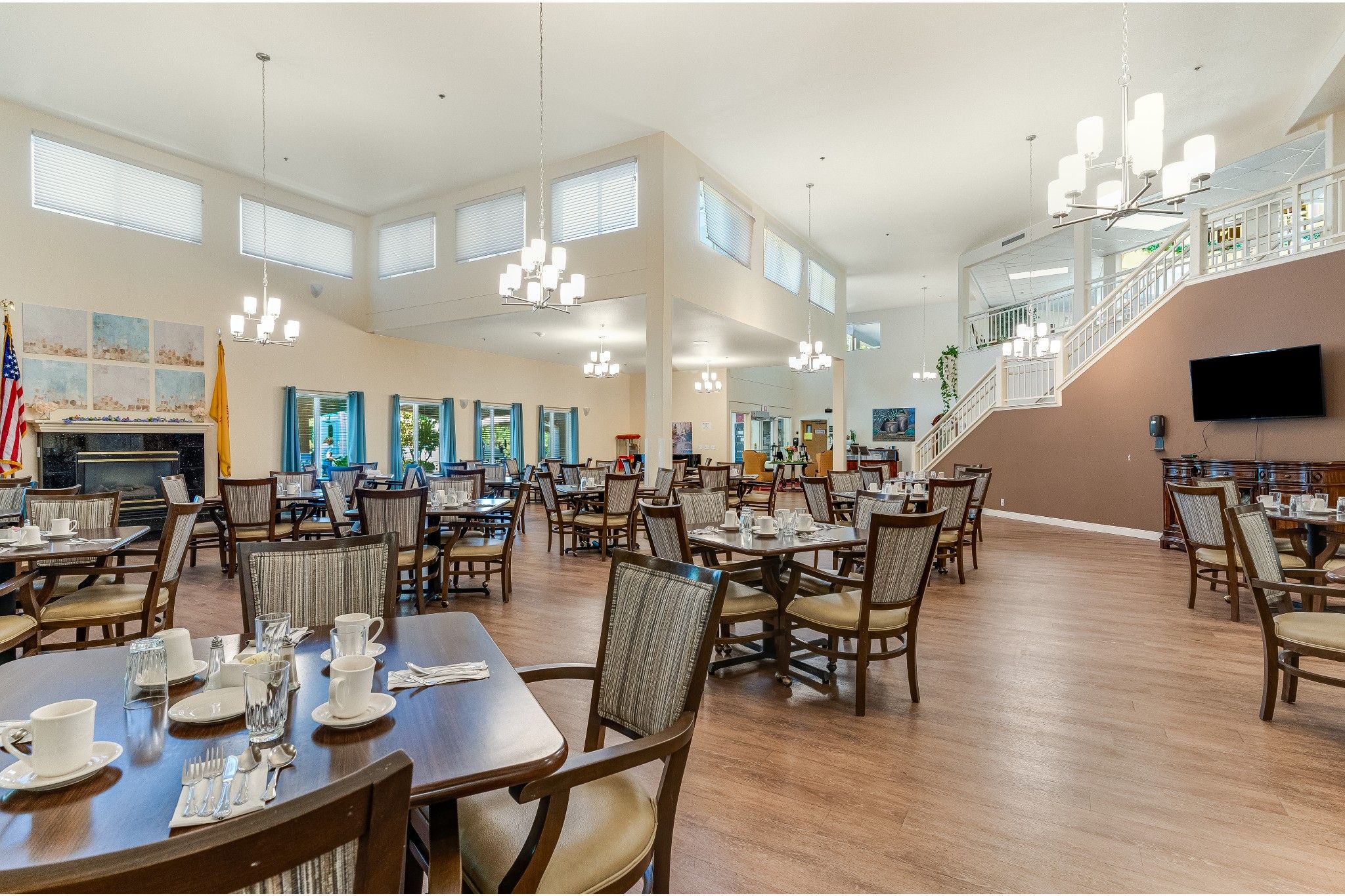 Bright dining room with tables set for meals