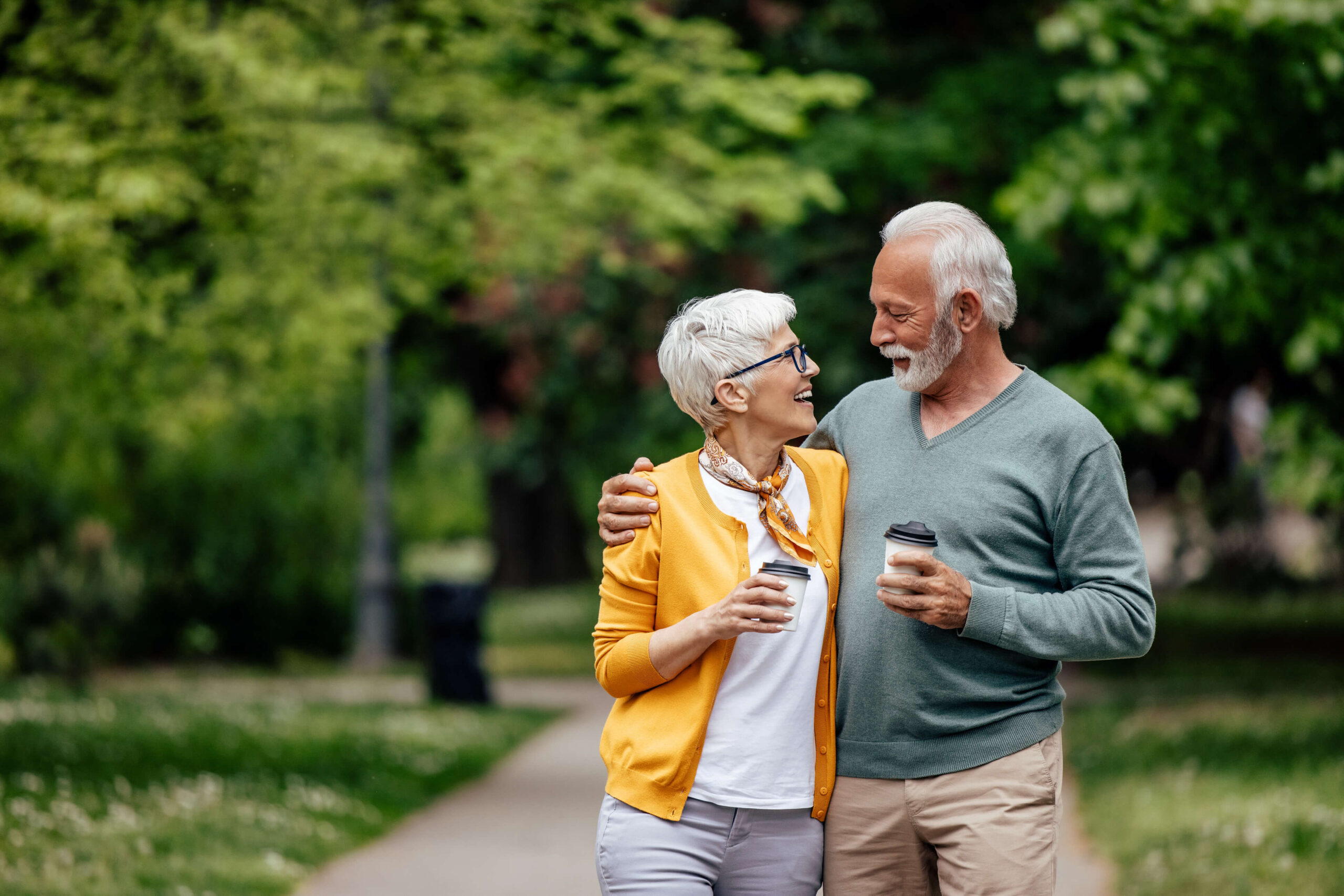Couple enjoying coffee in a park