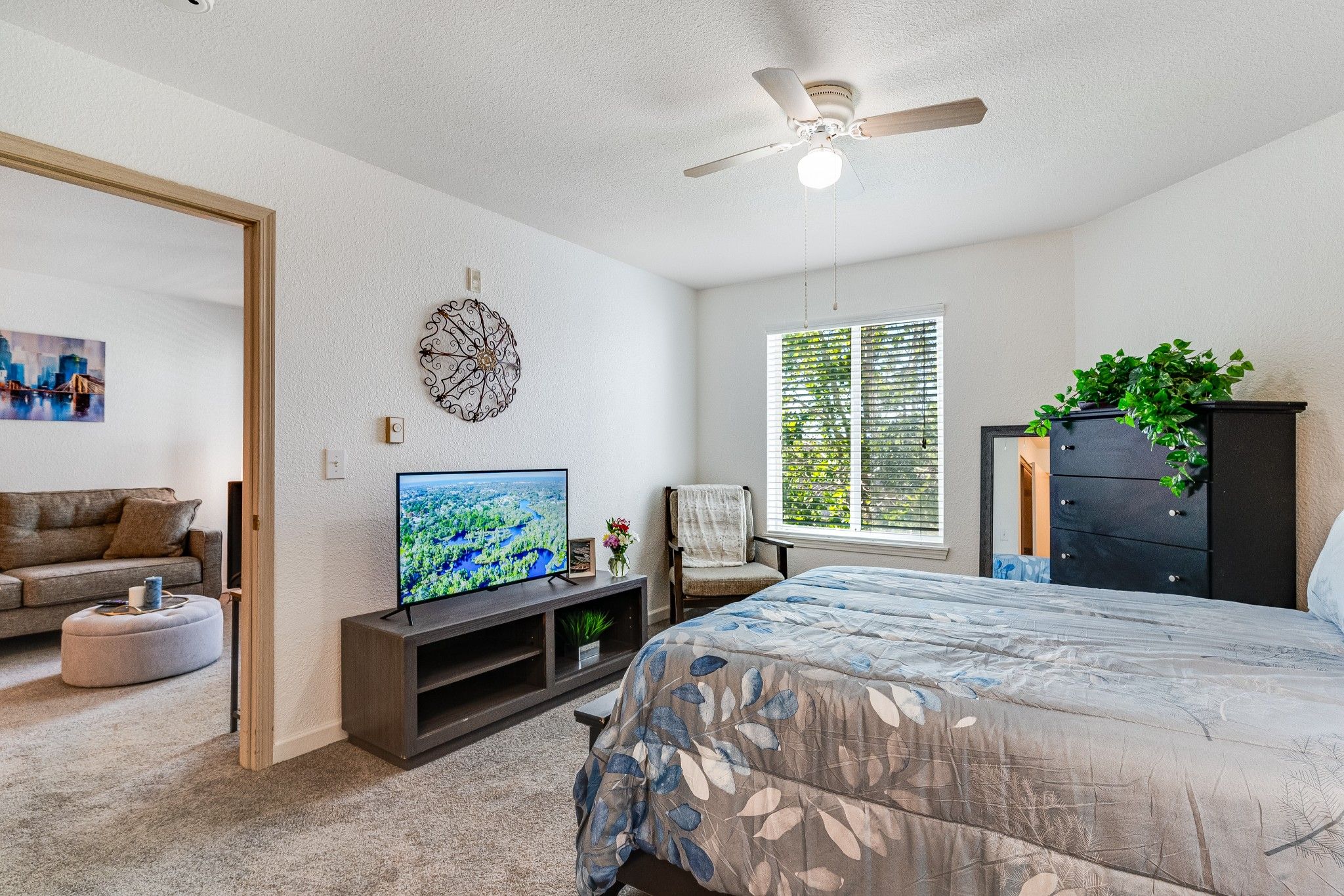A private resident room with a bed and a living area