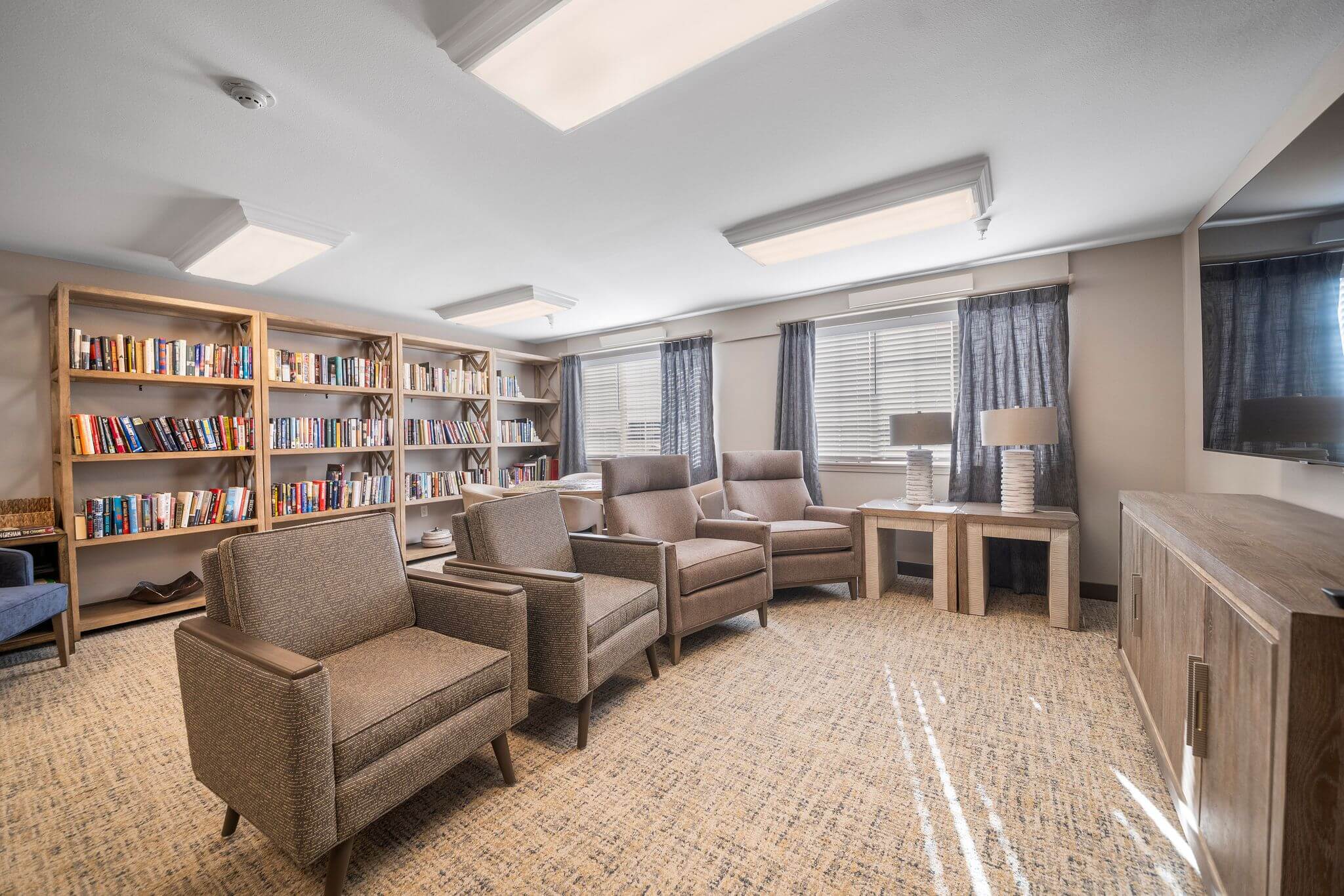 Cozy common area with bookshelves and seating