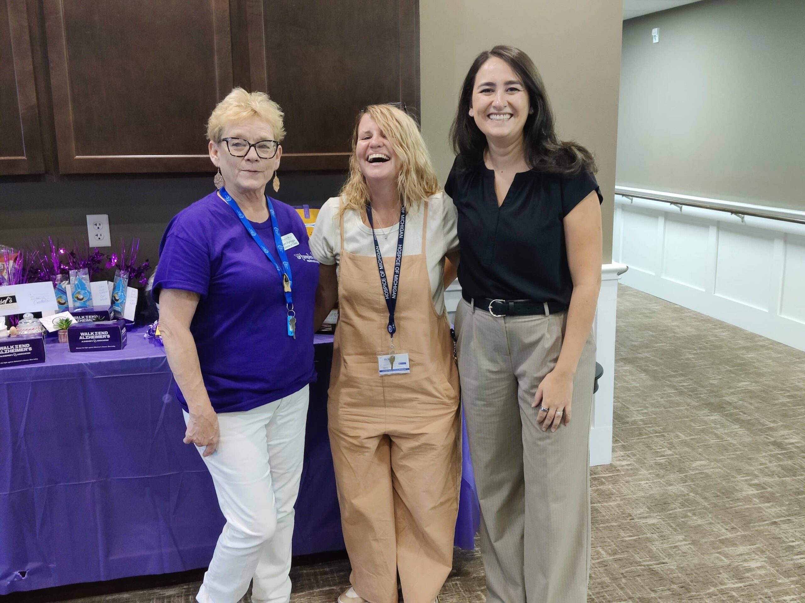 Staff members smiling together in a common area
