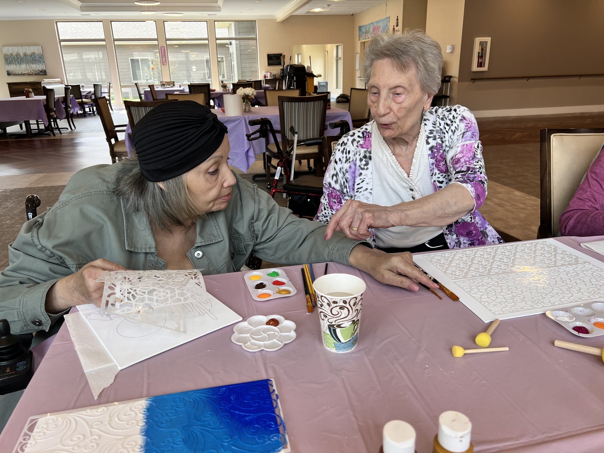 Residents engaged in an art activity together