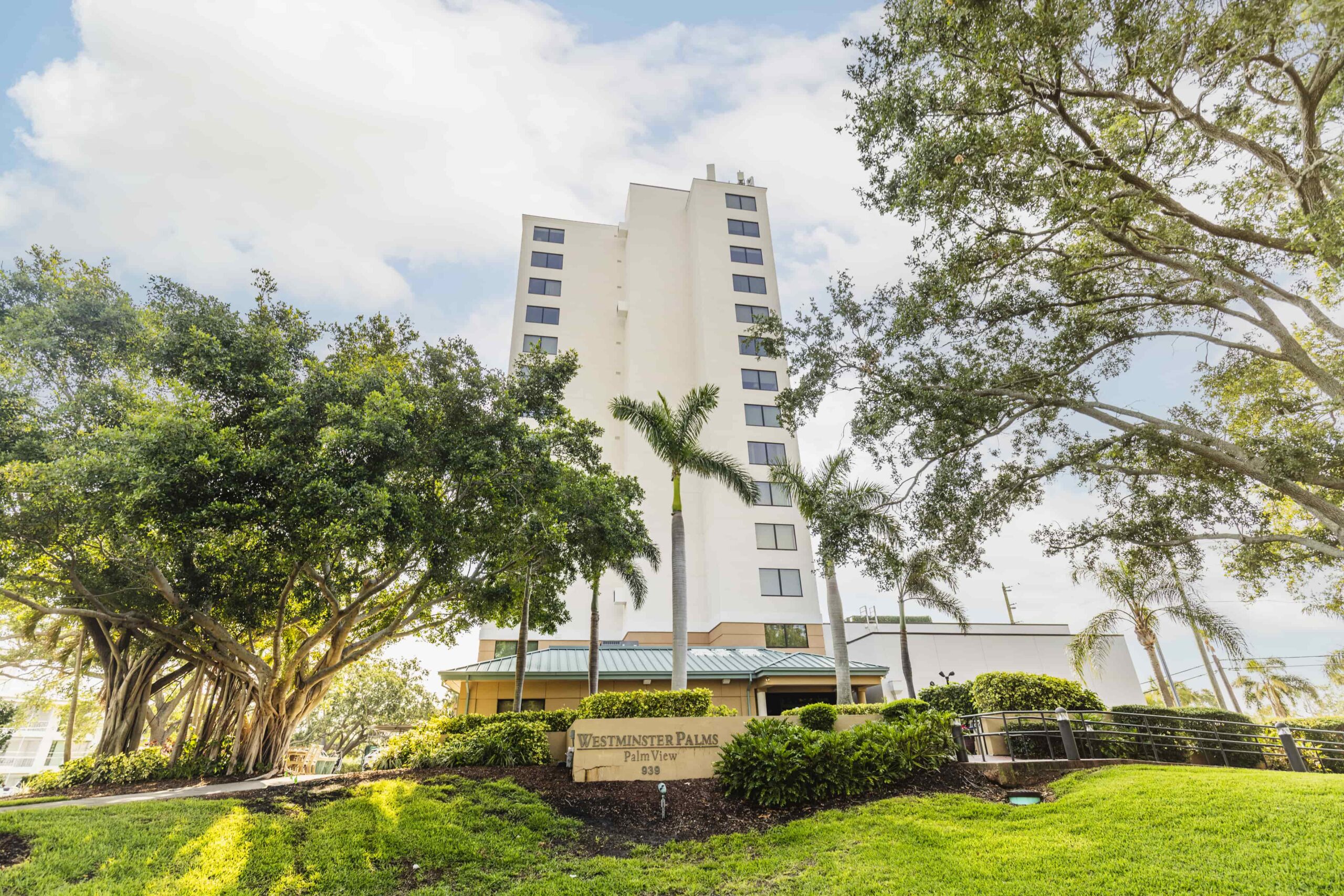Exterior view of Westminster Towers building surrounded by greenery