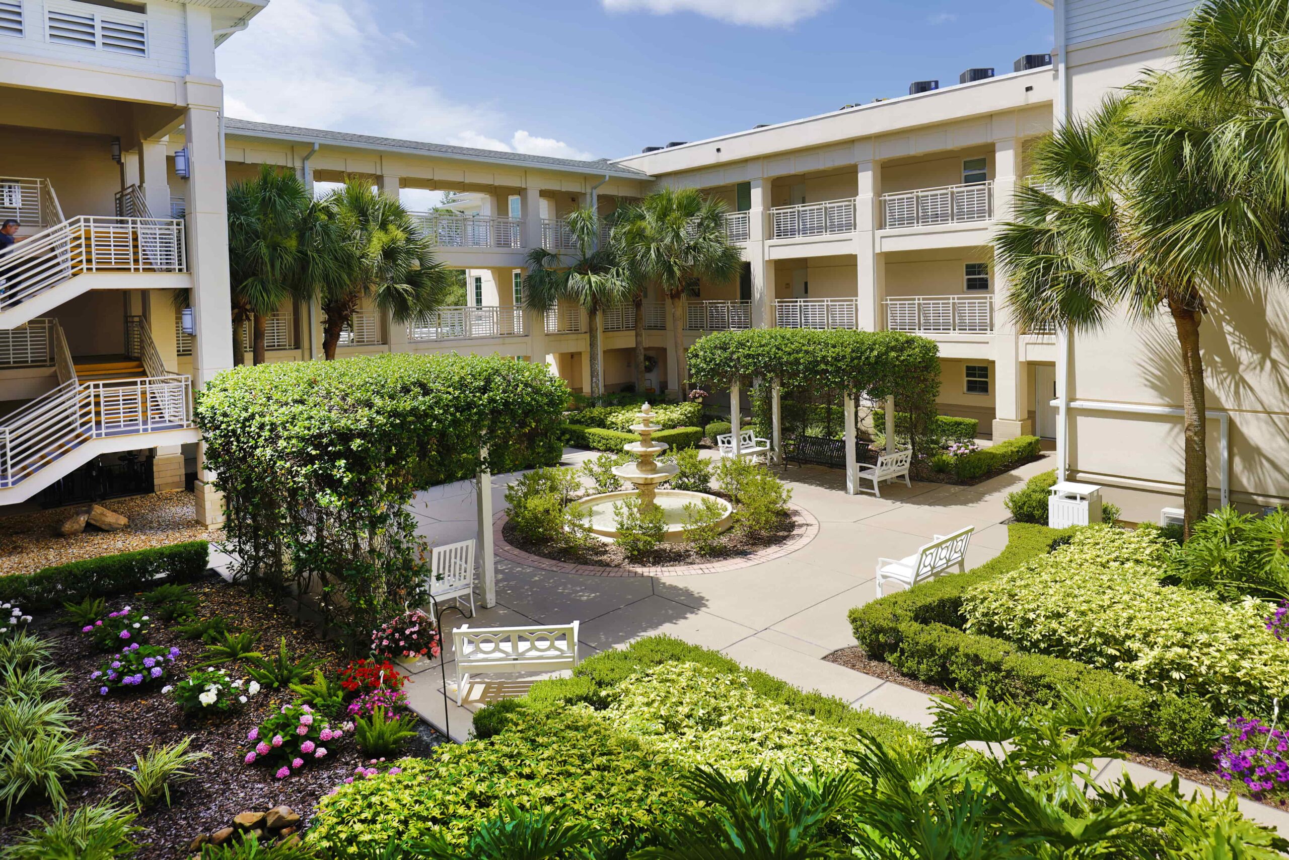Beautiful landscaped courtyard with fountain and seating